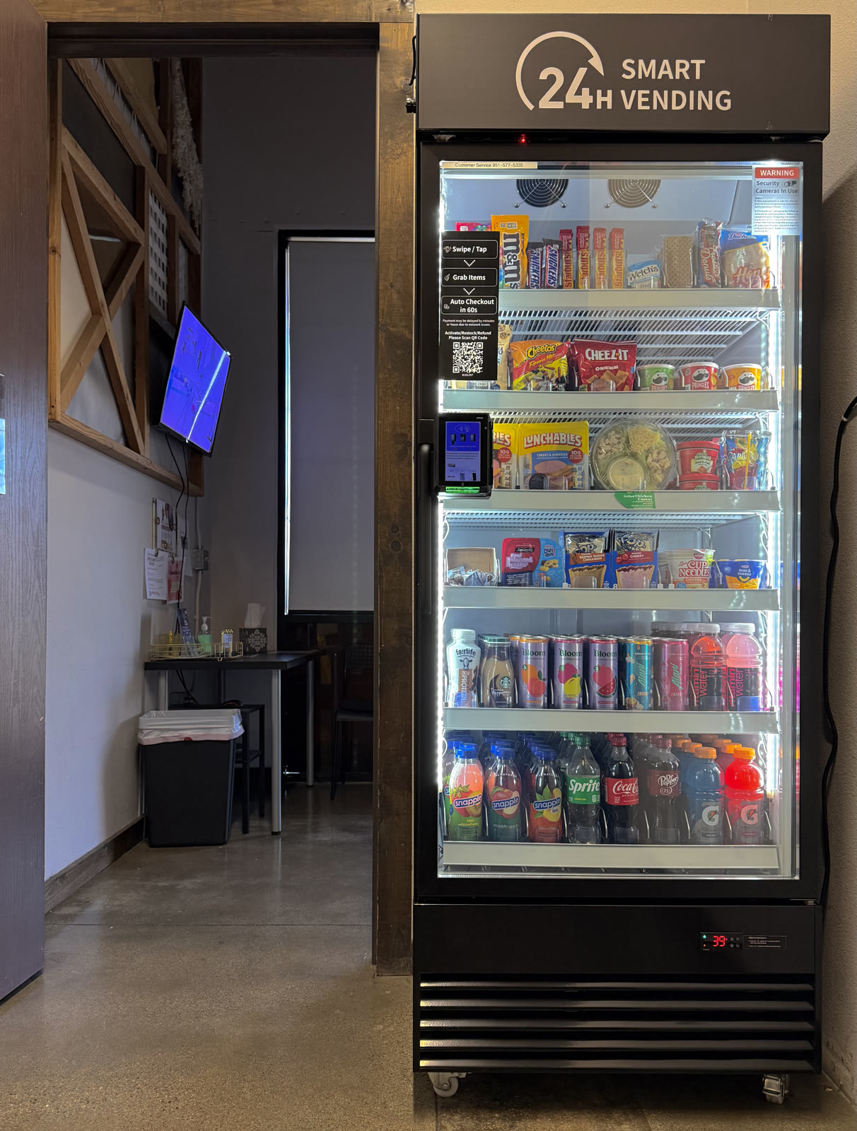 Stocked smart cooler beside a timber-framed doorway